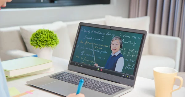 senior male college teacher teaching calculus online and student taking course by laptop at home