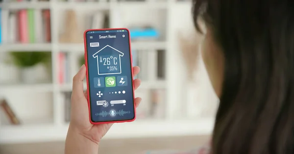 Iot Smart Home Concept Rear View Asian Woman Ask Smartphone — kuvapankkivalokuva