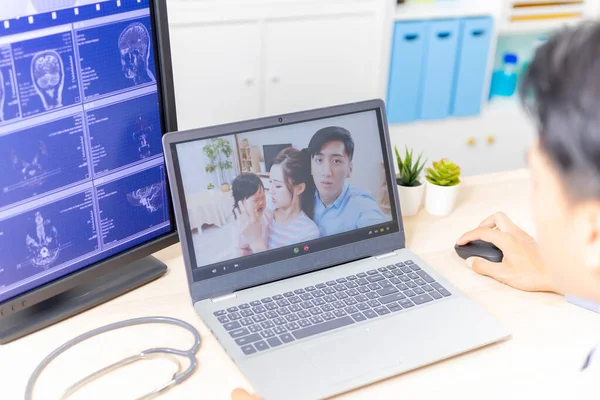 Telemedicine Concept Back View Asian Male Pediatrician Listening Family Laptop — Stok fotoğraf