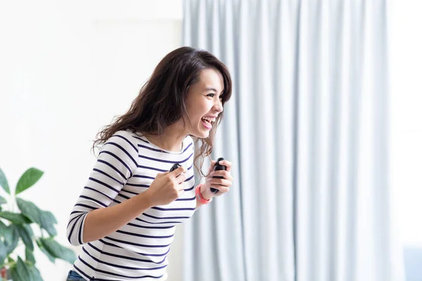 Asian Woman Playing Motion Sensing Game Win Home — Stock Photo, Image