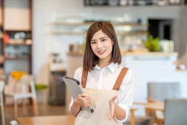 Young Asian Shopkeeper Smile You Hold Menu Her Restaurant — Zdjęcie stockowe