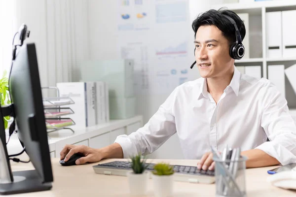 Telework Concept Asian Businessman Wearing Headset Using Computer Join Video Fotos De Bancos De Imagens