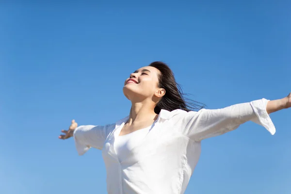 Asian Young Woman Cheering Open Arms Isolated Sky Blue Background — Stock Photo, Image