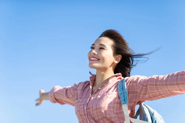 Asian Young Female Traveler Cheering Open Arms Isolated Sky Blue — Stock Photo, Image