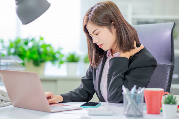 Tired Asia Businesswoman Woman Massaging Rubbing Stiff Sore Neck Tensed Stock Photo