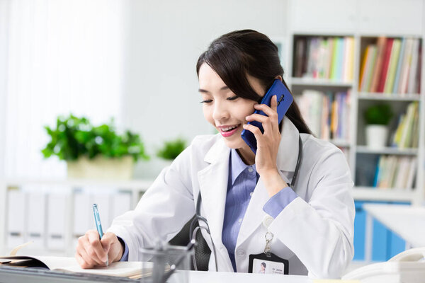 Telemedicine Concept Asian Female Doctor Listening Patient Talking Symptom Mobile Royalty Free Stock Images