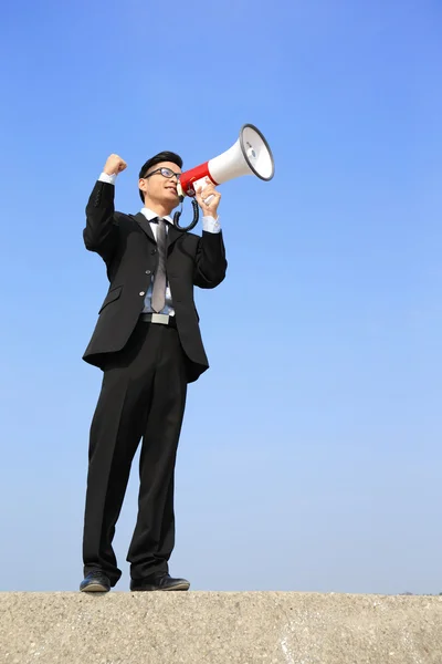 Homem de negócios usando megafone — Fotografia de Stock