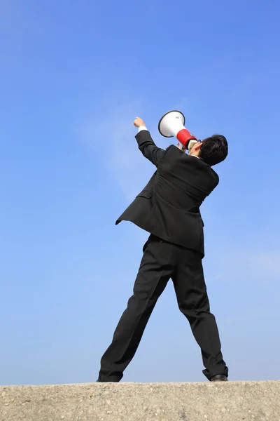 Homem de negócios usando megafone — Fotografia de Stock