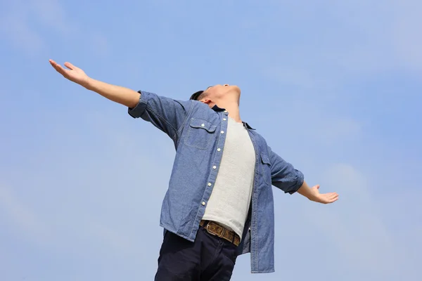 Carefree  man raising arms — Stock Photo, Image