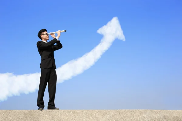 Businessman with telescope — Stock Photo, Image