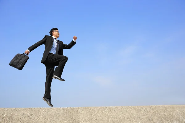 Happy business jumping — Stock Photo, Image