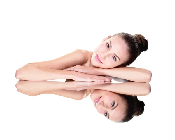 Woman lying down on mirror — Stock Photo, Image