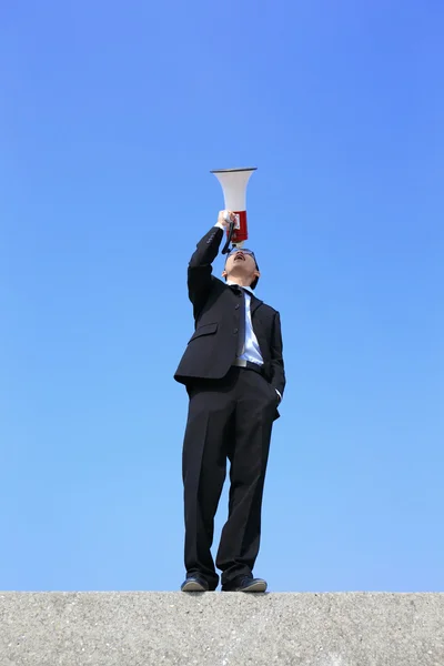 Business man using megaphone — Stock Photo, Image