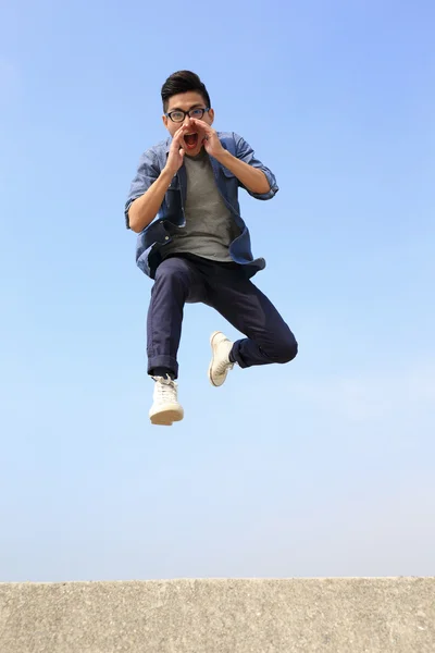 Happy College student jumping — Stock Photo, Image