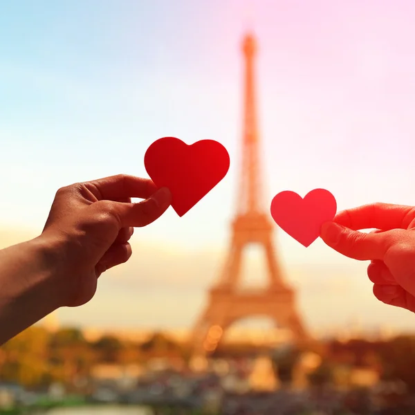 Hands holding paper hearts — Stock Photo, Image