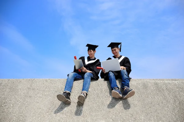 Graduate student using  computers — Stock Photo, Image