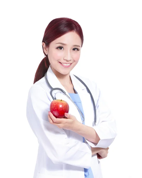 Doctor sosteniendo manzana y estetoscopio . — Foto de Stock