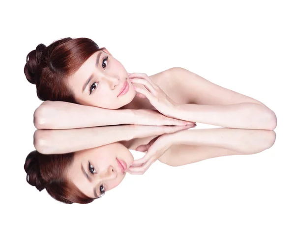 Woman lying down on mirror — Stock Photo, Image