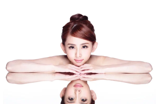 Woman lying down on mirror — Stock Photo, Image