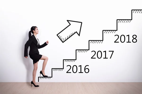 Business woman stepping up on stairs — Stock Photo, Image