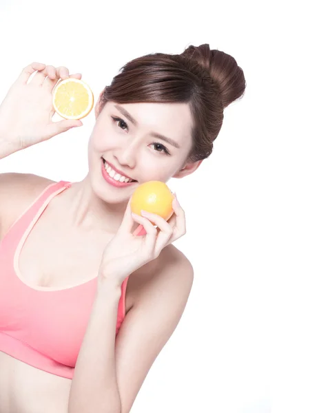 Woman showing  oranges — Stock Photo, Image
