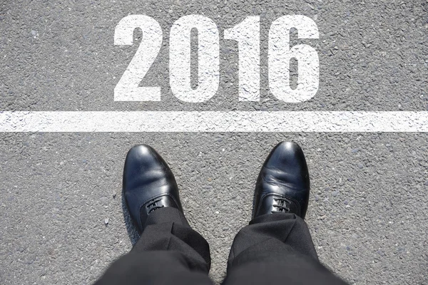 Business man walking on the road — Stock Photo, Image