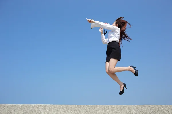 Business woman shouting in megaphone — Stock Photo, Image