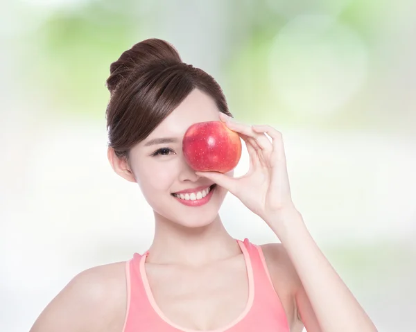 Woman showing  apple — Stock Photo, Image