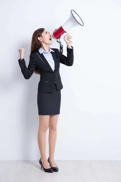 Business woman talking in megaphone — Stock Photo, Image