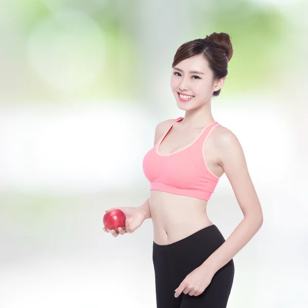 Woman showing  apple — Stock Photo, Image