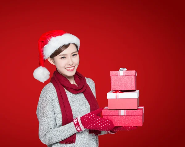 Woman holding Christmas gifts — Stock Photo, Image