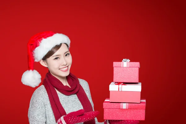 Woman holding Christmas gifts — Stok fotoğraf