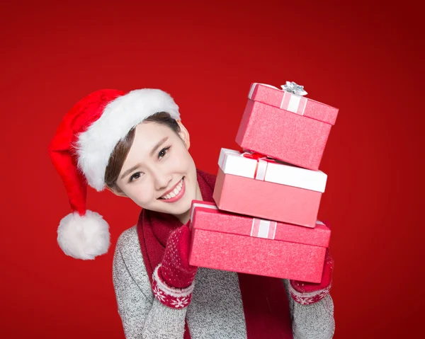 Woman holding Christmas gifts — Stok fotoğraf