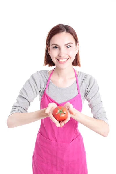 Домохозяйка с красным помидором — стоковое фото