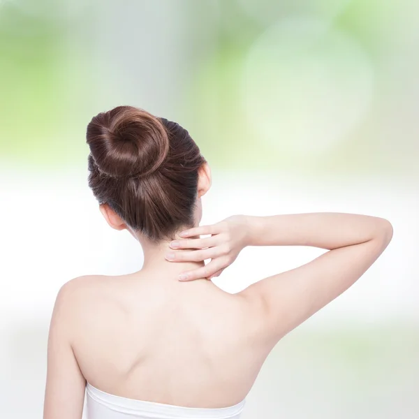 Woman massaging  back and shoulder — Stock Photo, Image