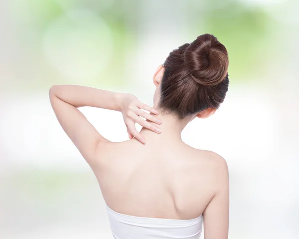 Woman massaging  back — Stock Photo, Image