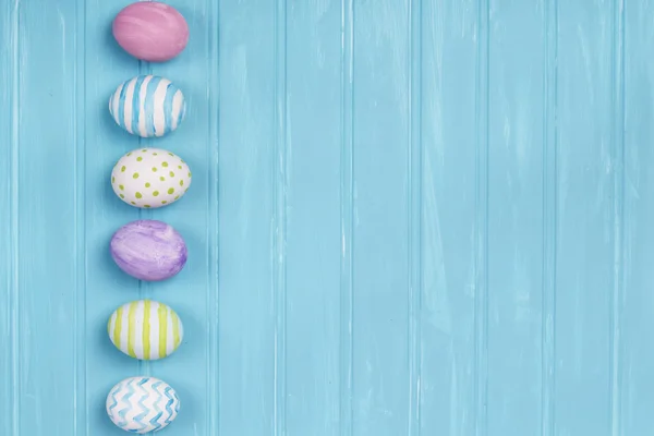 Easter eggs on a blue background — Stock Photo, Image