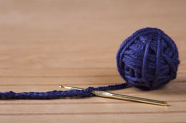 Ball of blue yarn with crochet needle — Stock Photo, Image