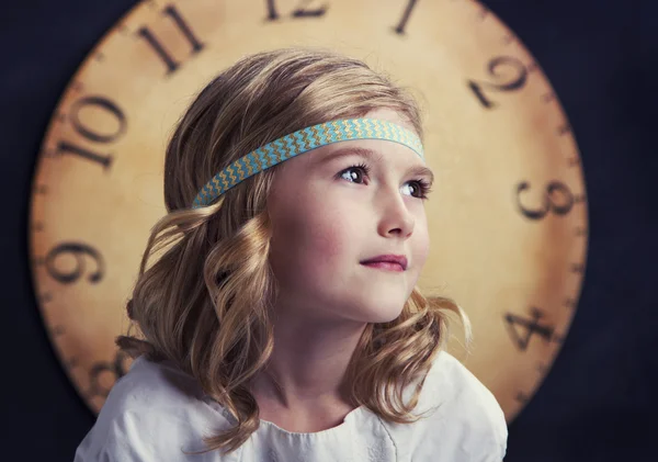 Young girl with large vintage clock — Stock Photo, Image