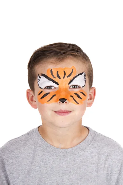 Young boy wearing tiger carnival face paint Stock Image