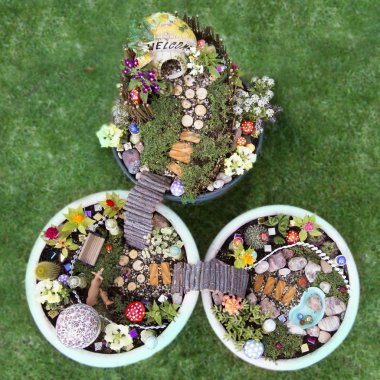 Birds eye view of fairy garden in a flower pot clipart