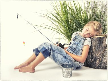 Child or young girl taking a nap or sleeping while fishing