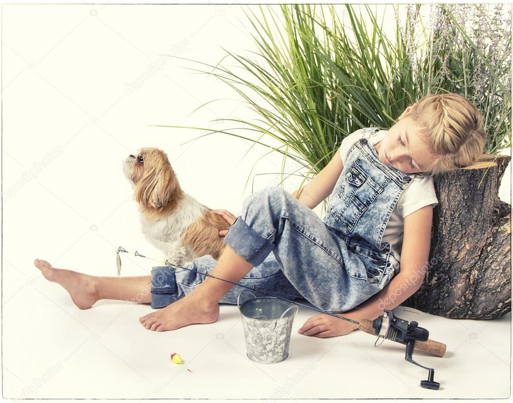 Child or young girl with her dog taking a nap or sleeping while 