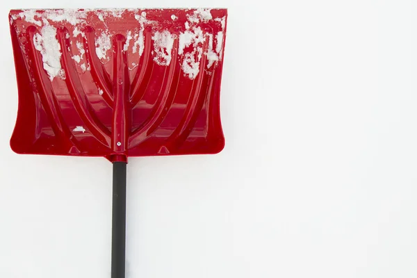 Snow shovel with snow — Stock Photo, Image