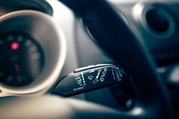 Car wiper controls on modern car. Cockpit interior of car with electronic controls of rain wipers — Stock Photo, Image