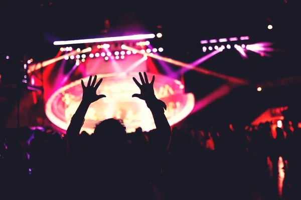 Girl dancing silhouette. Live concert or music festival with crowd dancing in lights — Stock Photo, Image