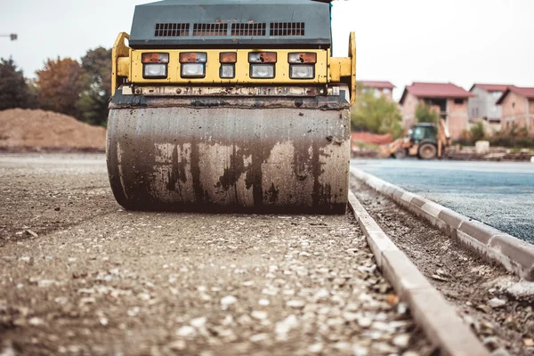 Industrial compactor on construction site. Road paving and compacting during high way construction — Stock Photo, Image