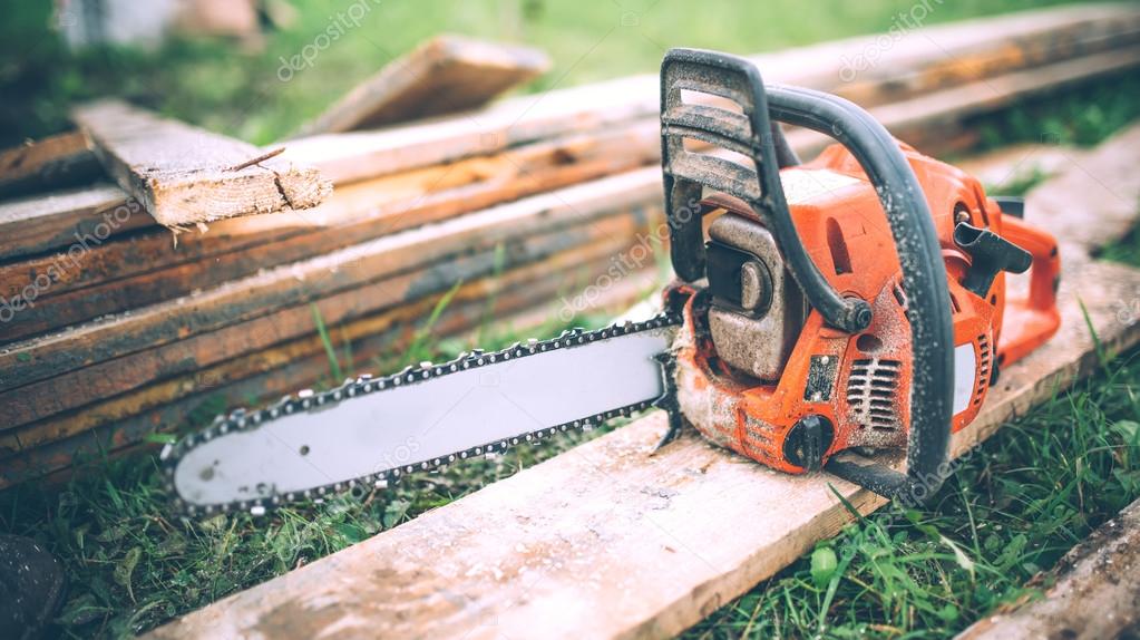 close-up view of chainsaw, construction tools, agriculture details. Gardening equipment