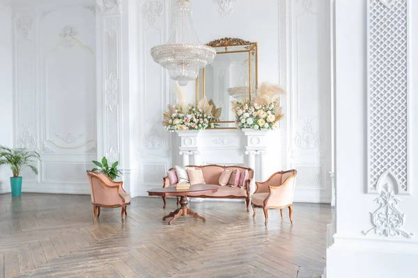 royal baroque style luxury posh interior of large room. extra white, full of day light. high ceiling and walls decorated by stucco