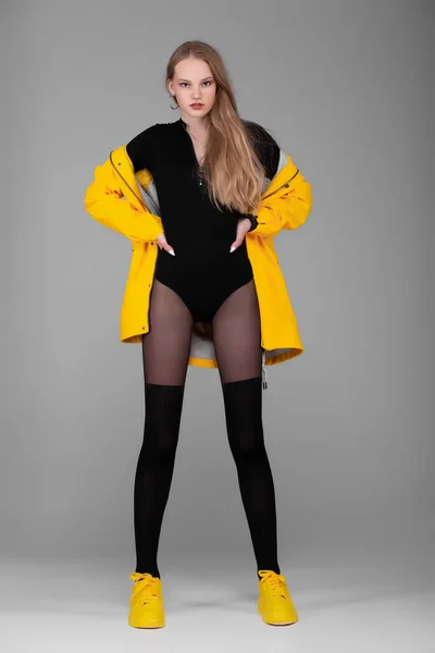 Girl Full Growth Posing Studio Clothes Yellow Jacket Raincoat Black — Stock Photo, Image